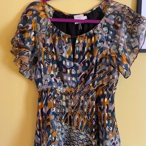 Anthropology light lady’s beautiful top with golden accents. By HD in Paris.